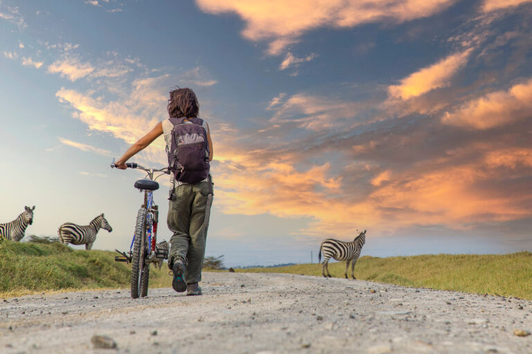 A,Girl,On,A,Bike,Next,To,Zebras,In,Naivasha